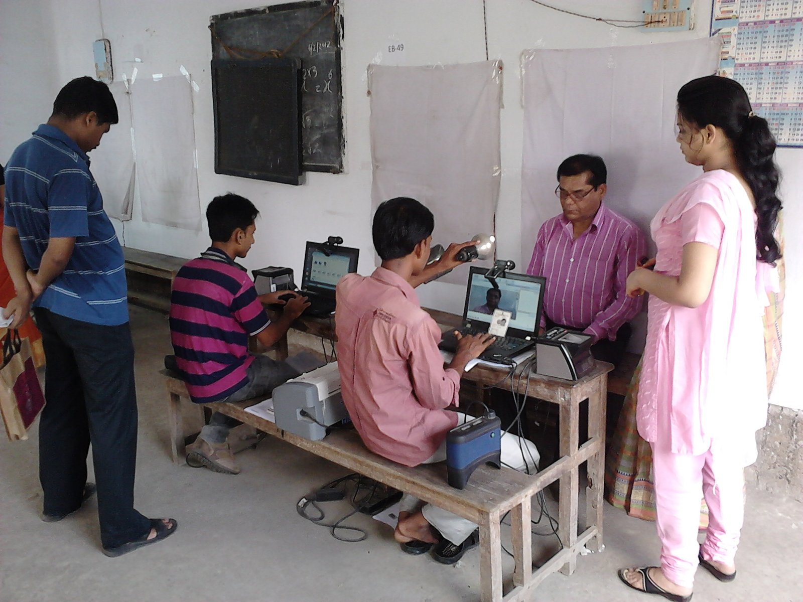 Aadhaar biometric data collection in India illustrating fingerprint and identity enrolment
