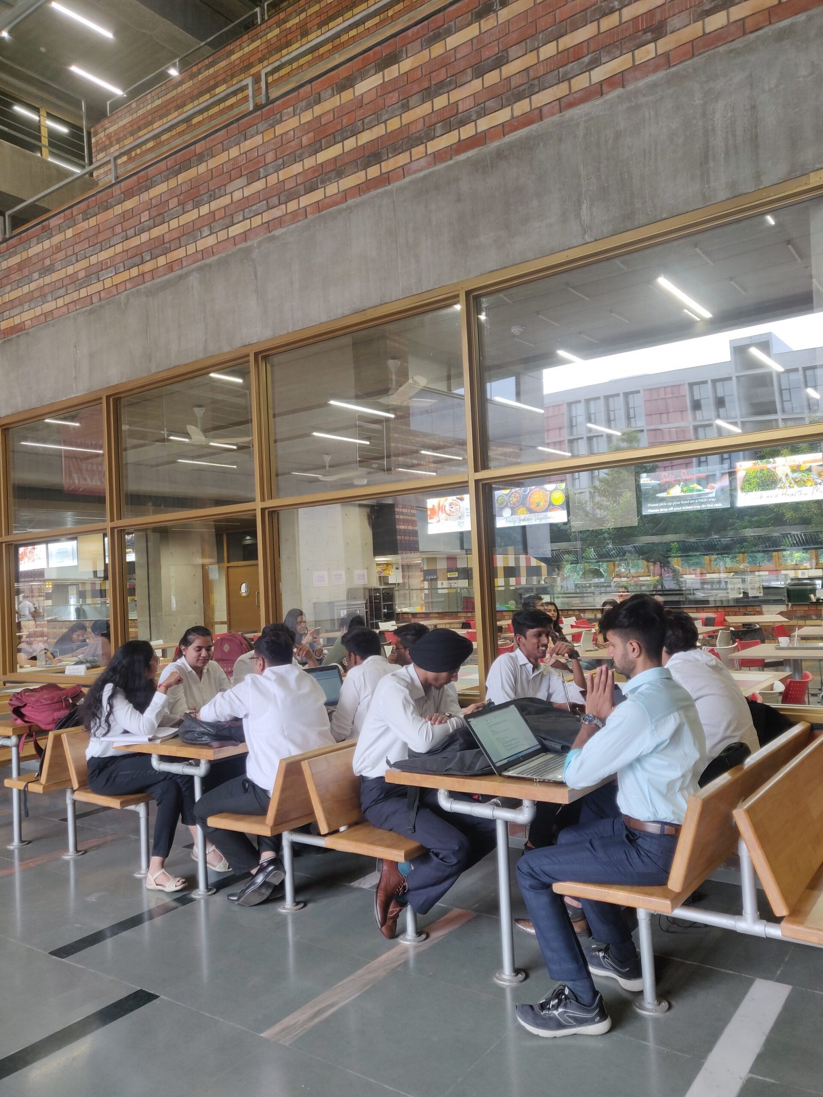 Postgraduate students studying together on a university campus in India