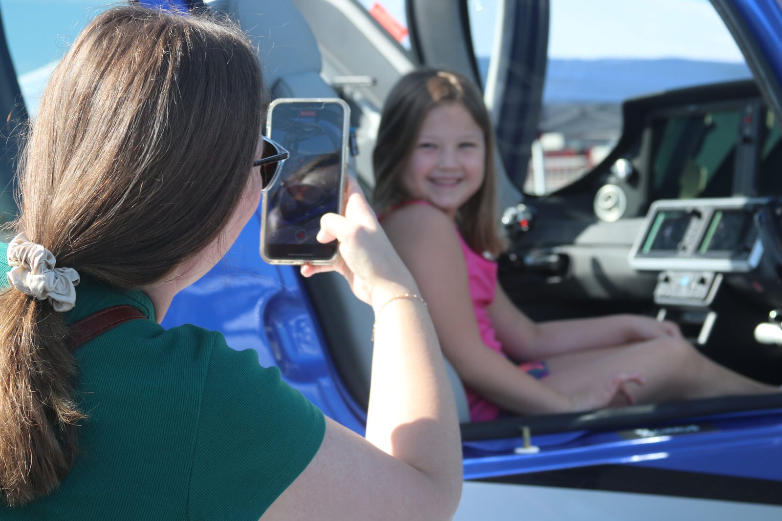 Child sitting in an aircraft during a family aviation event