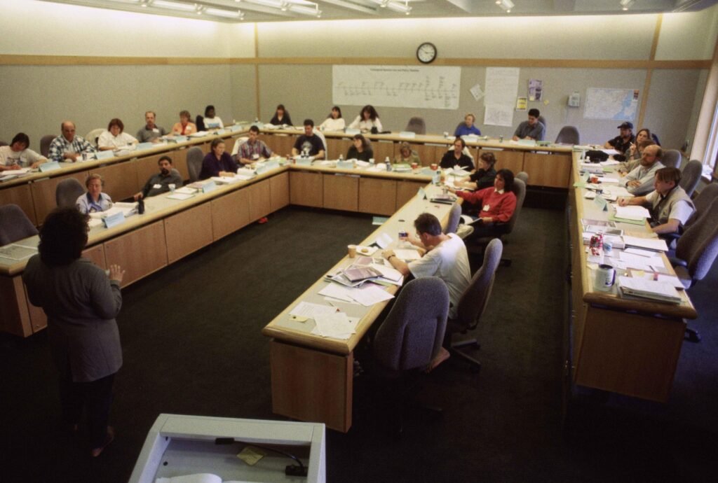 Lecturer speaking to students in a classroom