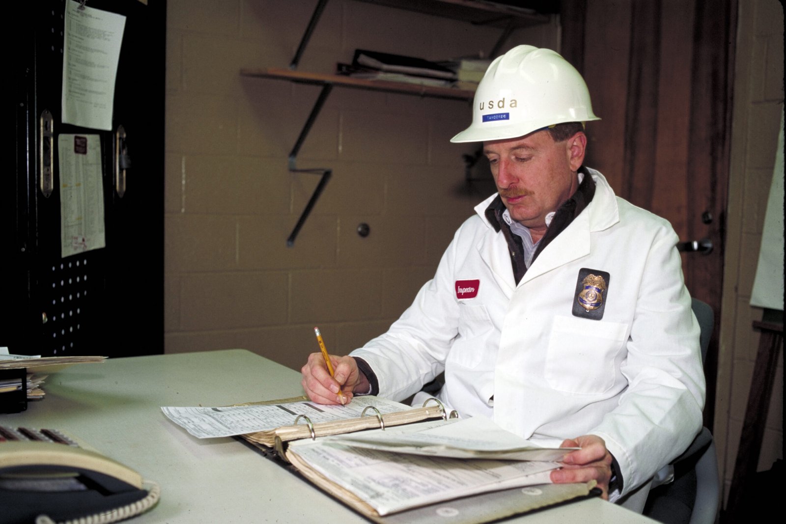 Food safety inspector reviewing HACCP records
