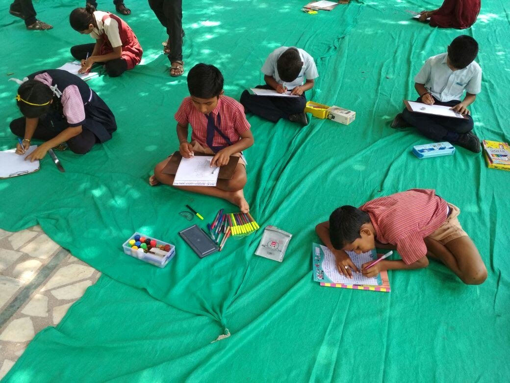 Indian school children studying, illustrating the education context behind child labour age rules