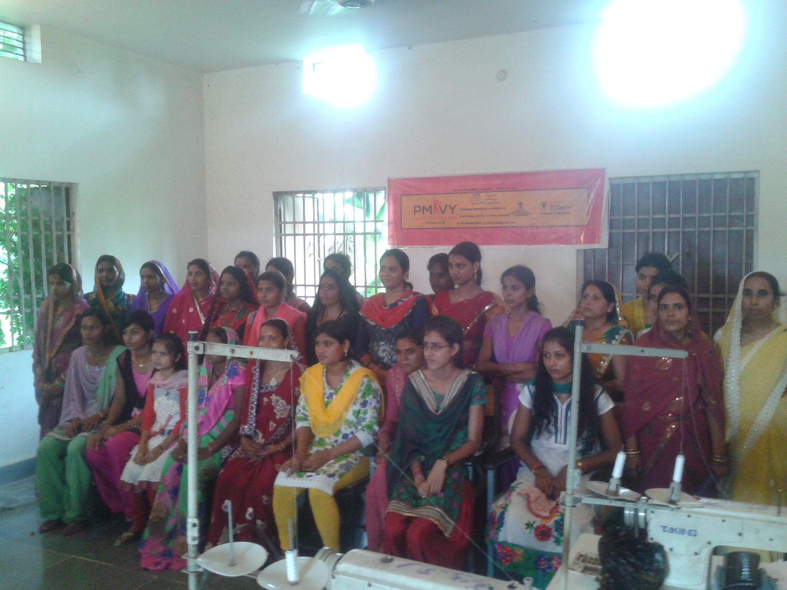 Women participating in sewing machine skill training in India