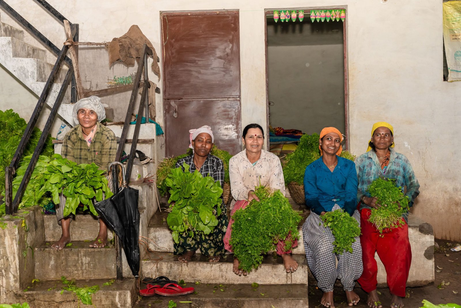 Women farmers with fresh produce, illustrative image for Lakhpati Didi