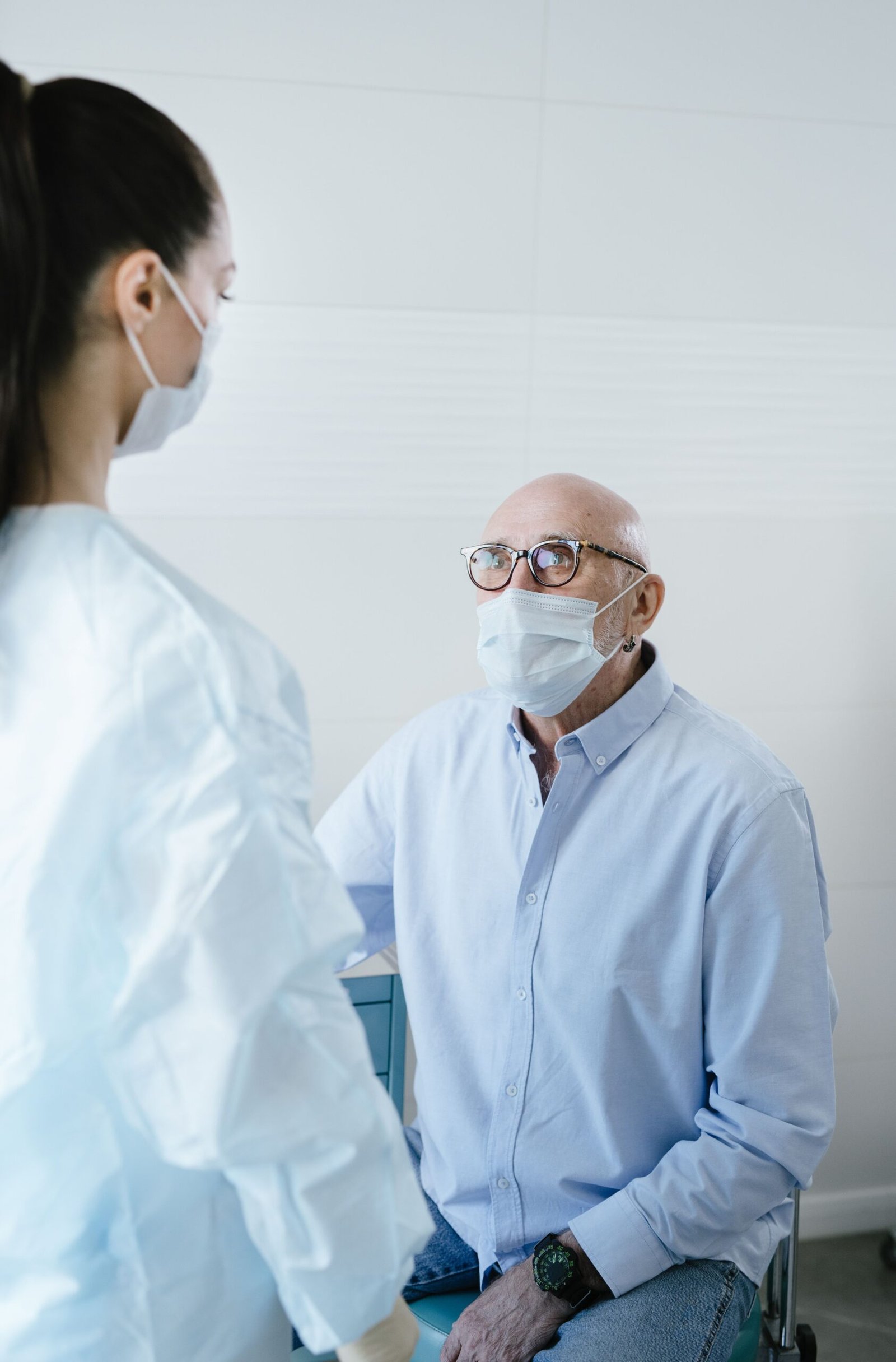 Senior patient discussing healthcare with a doctor in a clinic