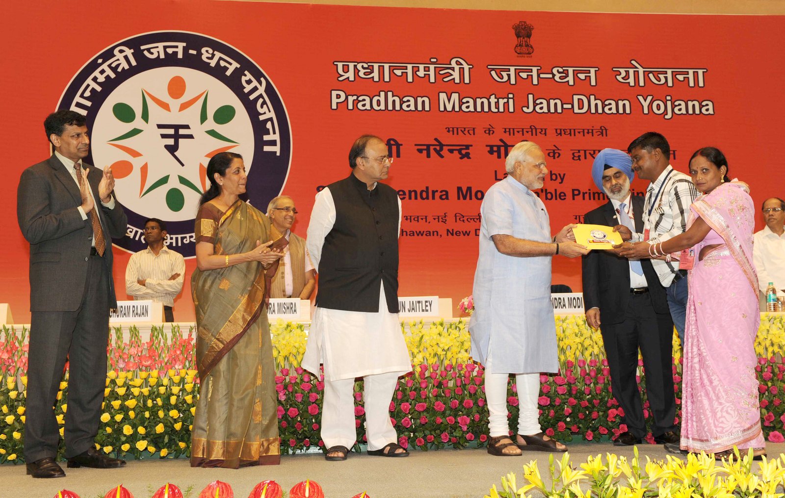 Pradhan Mantri Jan-Dhan Yojana account opening kit being presented to beneficiaries