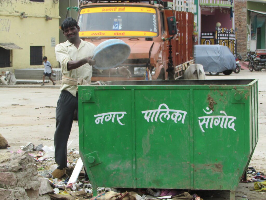 Municipal sanitation worker handling waste in Rajasthan