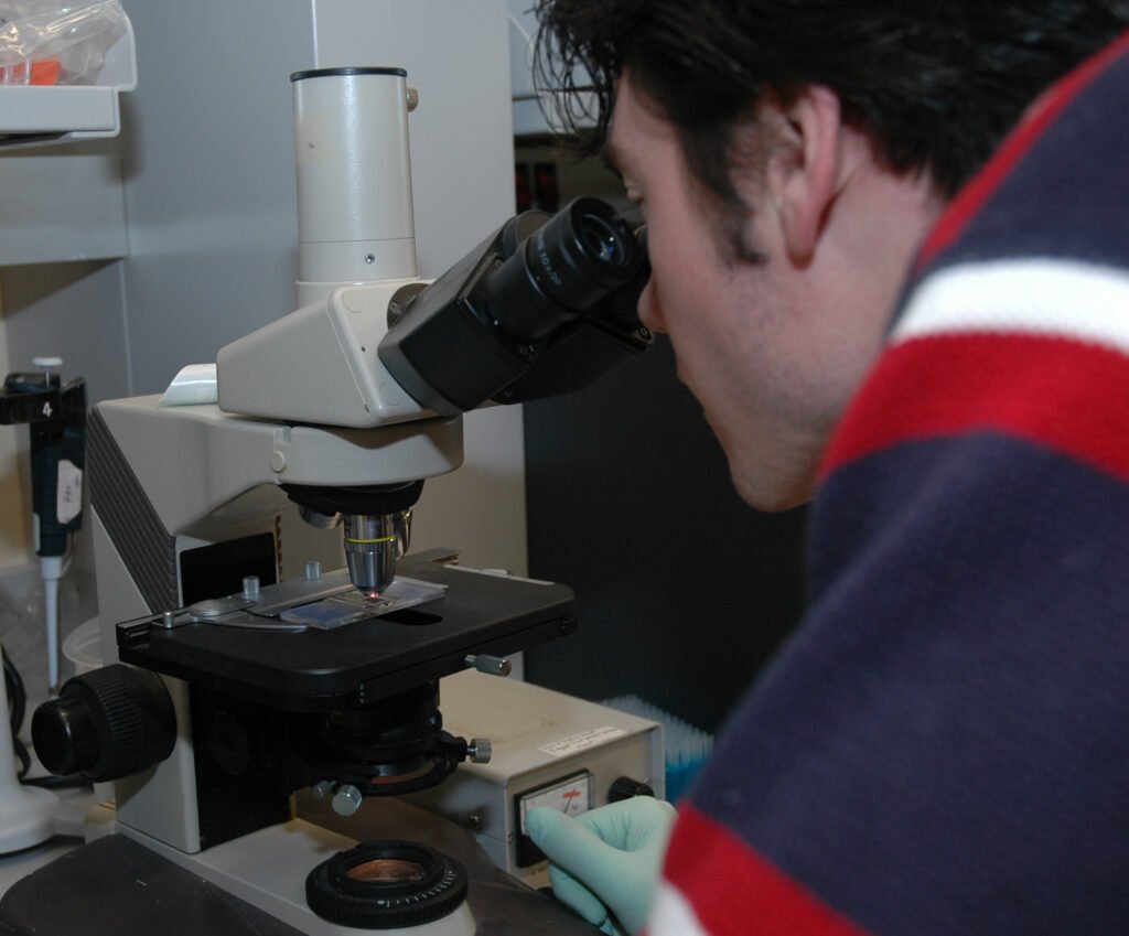 Scientist working with laboratory equipment
