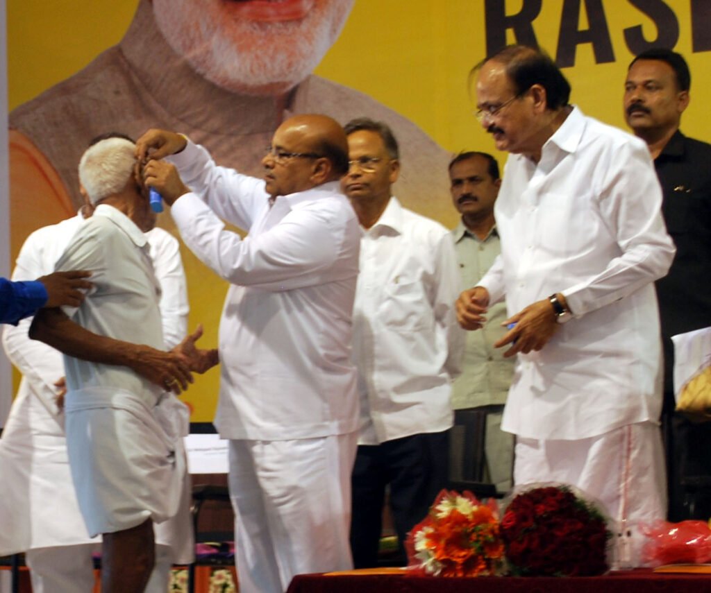 Senior citizen age in India illustrated by an Indian senior citizen receiving a hearing aid under Rashtriya Vayoshri Yojana
