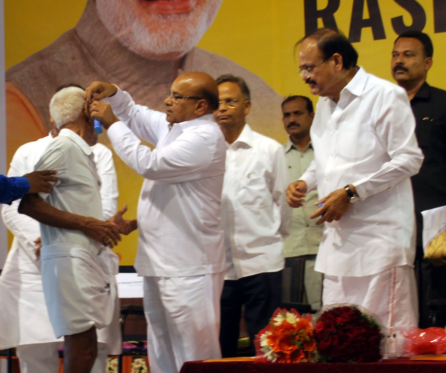 Senior citizen age in India illustrated by an Indian senior citizen receiving a hearing aid under Rashtriya Vayoshri Yojana