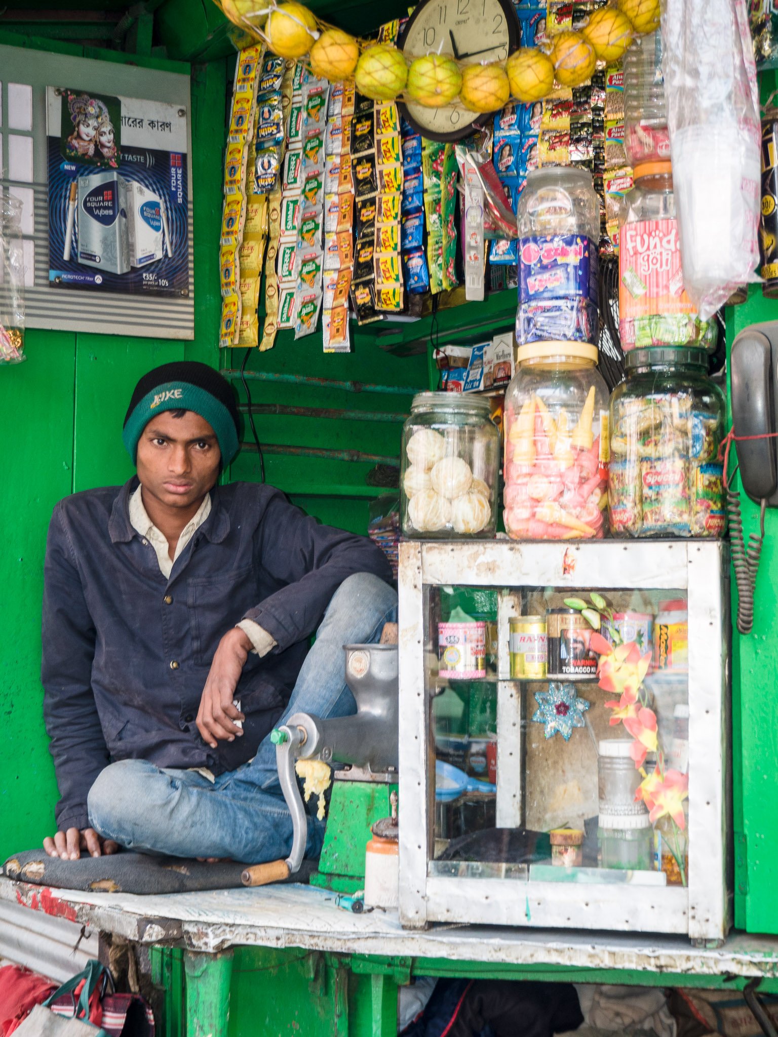 Indian shopkeeper working inside a retail shop