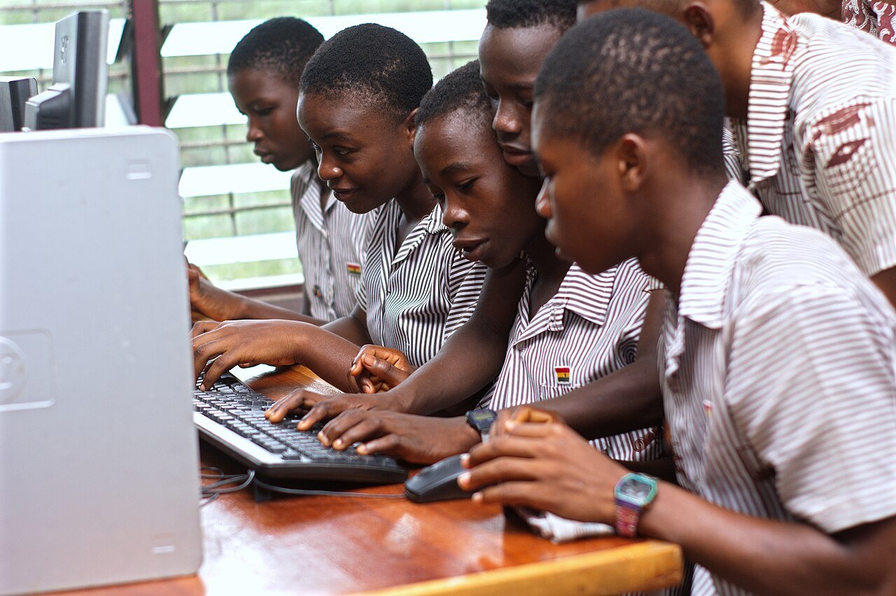 Students using computers in a classroom setting
