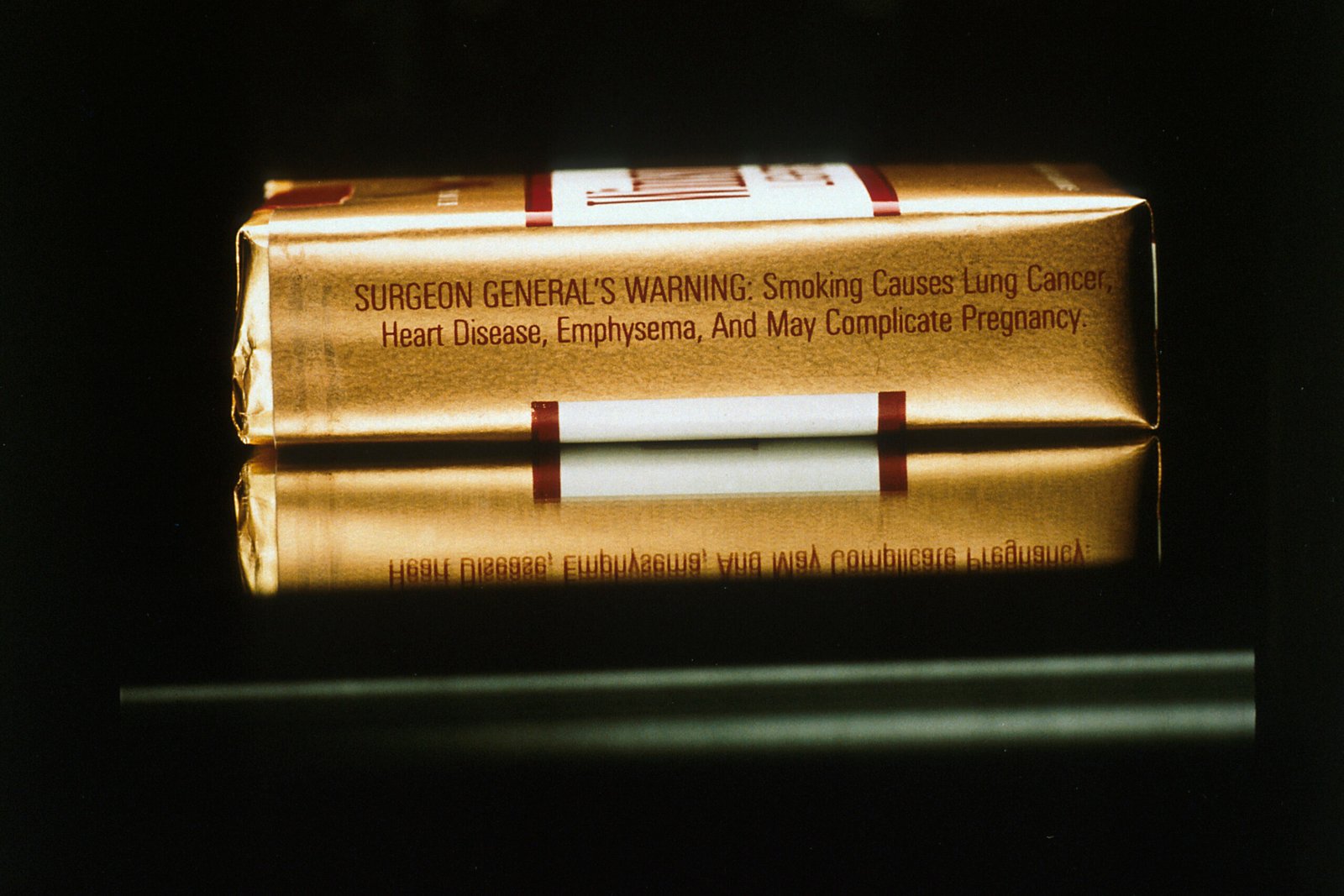 Cigarette pack displaying a health warning, used as a visual example for tobacco age rules
