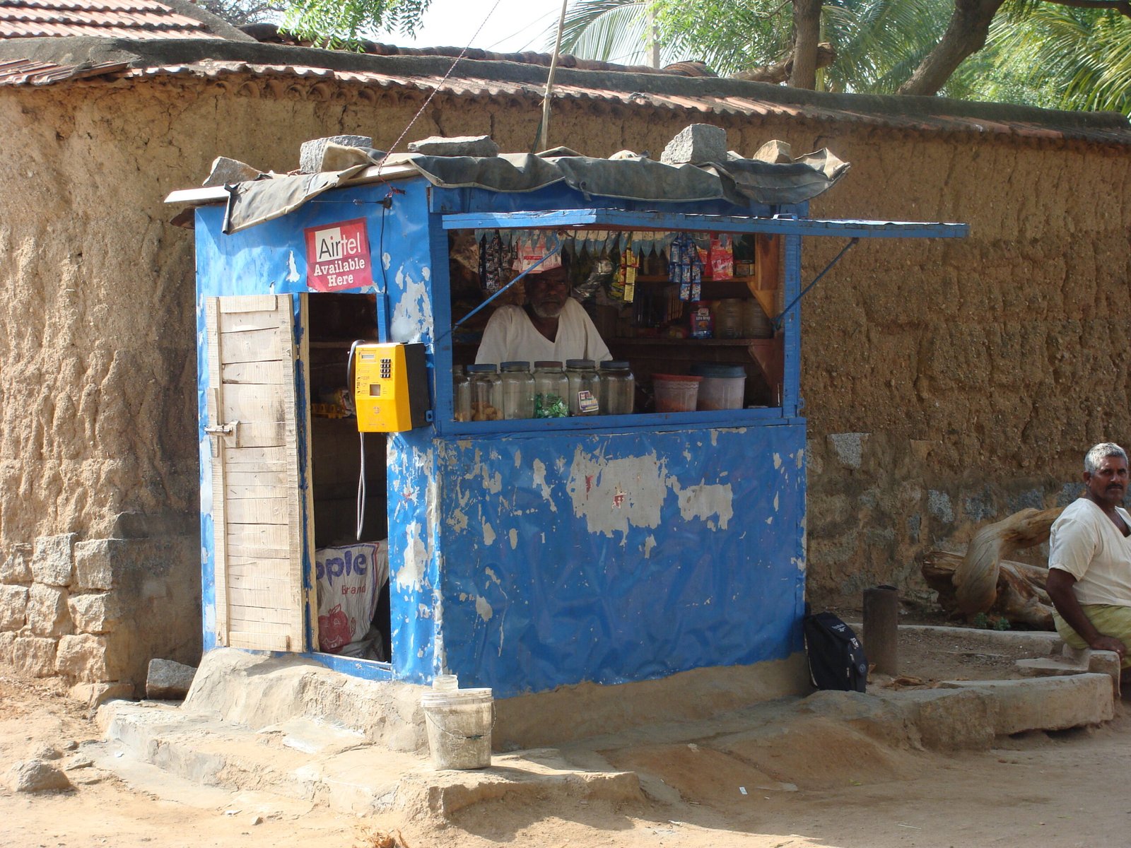 Village kiosk in India illustrating a small business