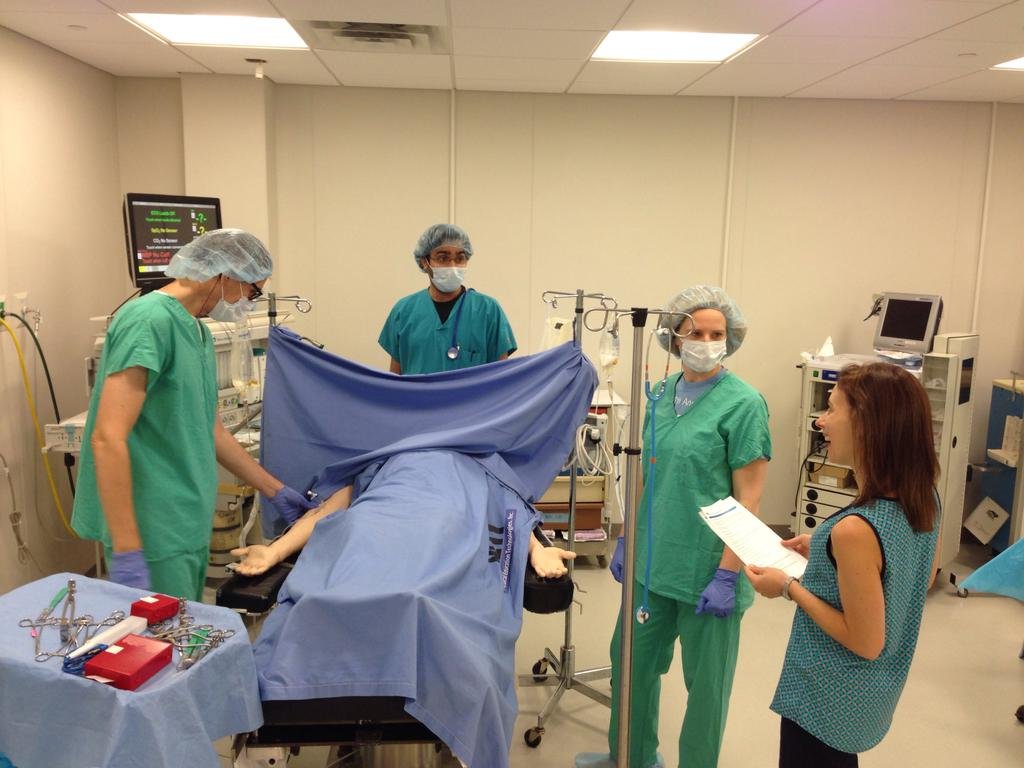 Medical team conducting an anaesthesia resident simulation in an operating-room training setting