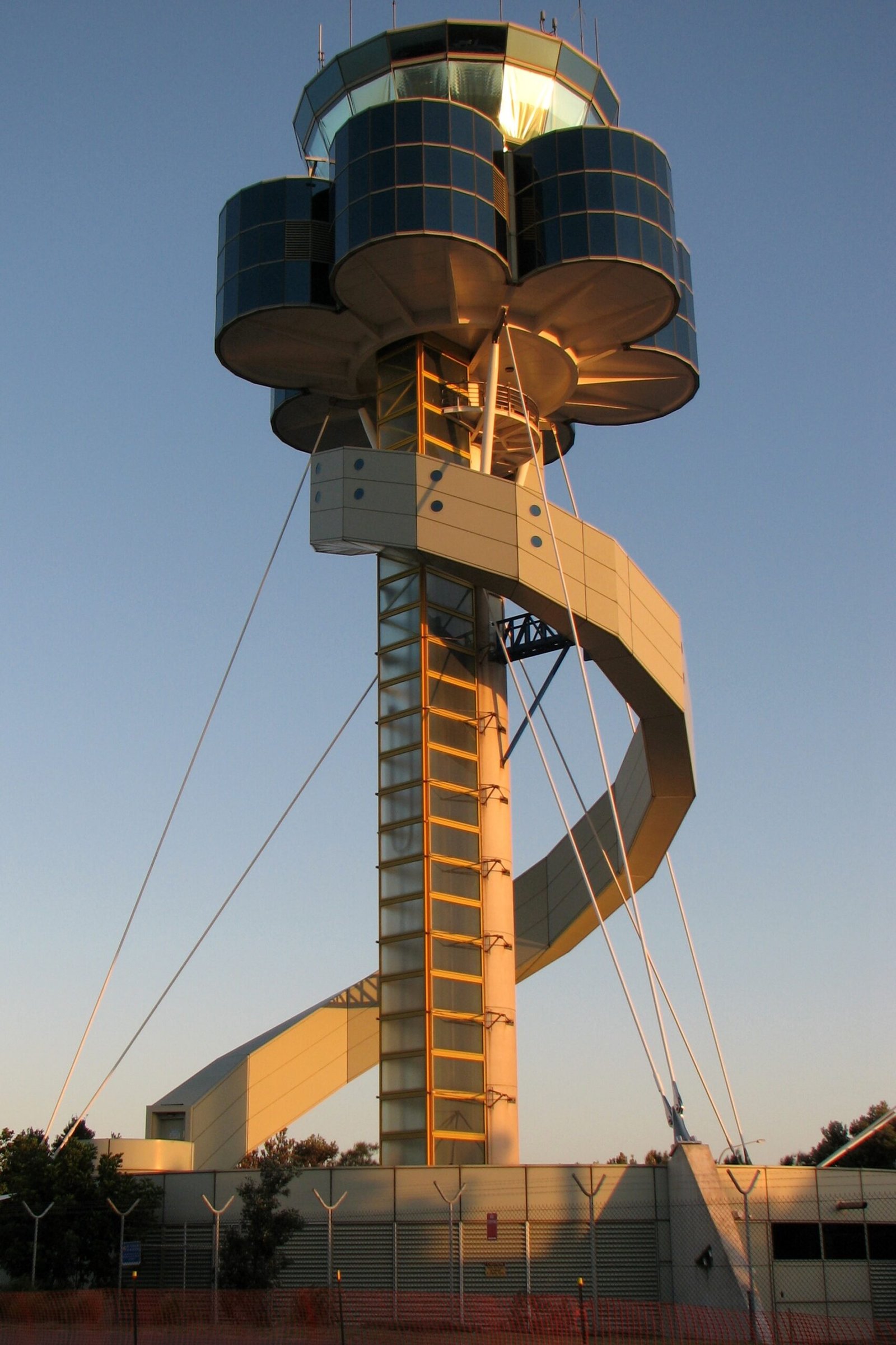 Airport air traffic control tower rising above the airport