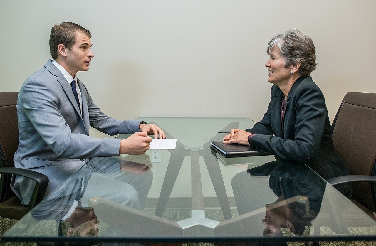 Job interview between a candidate and interviewer