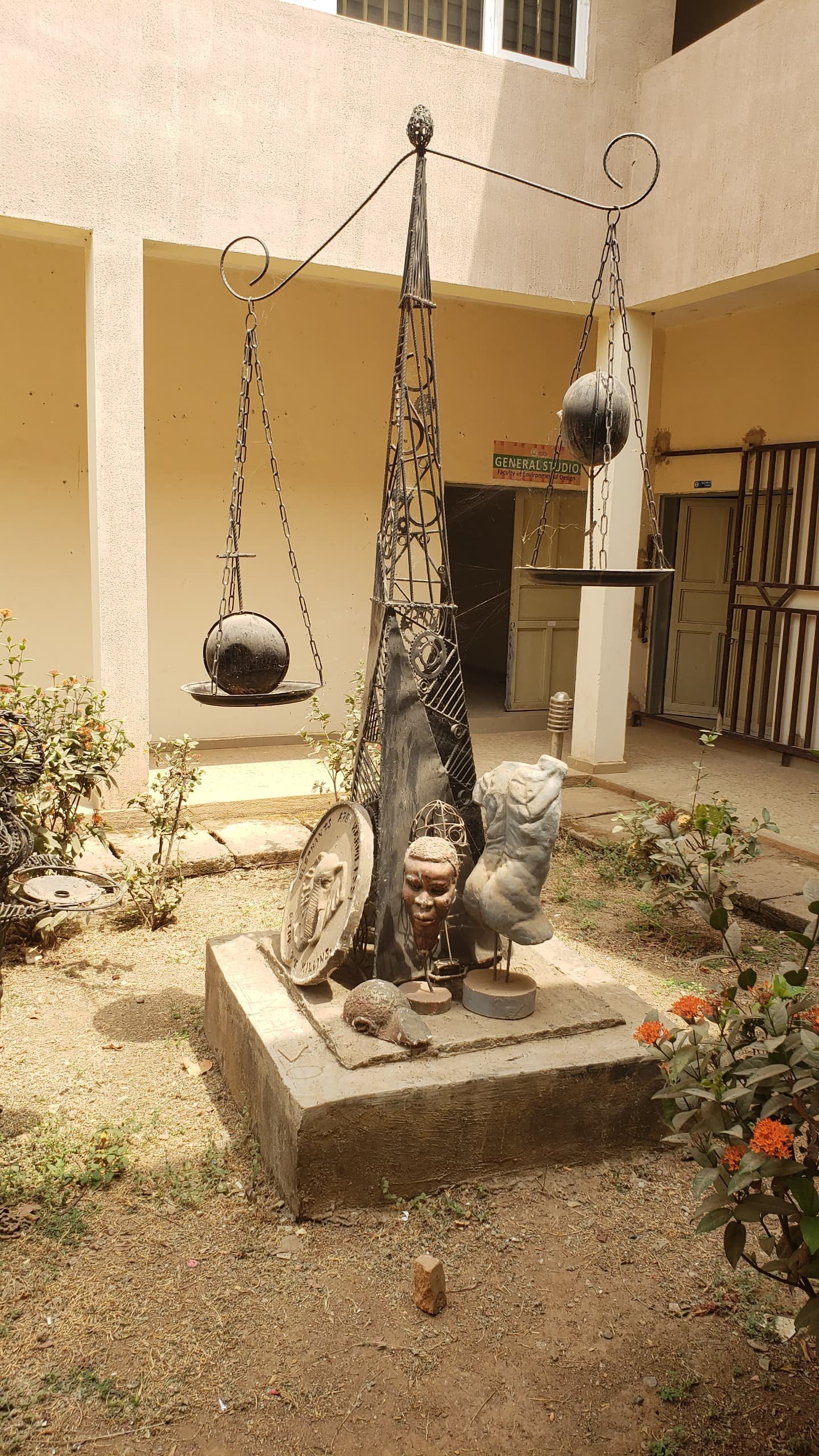 A sculptural balance scale representing justice and legal decision-making
